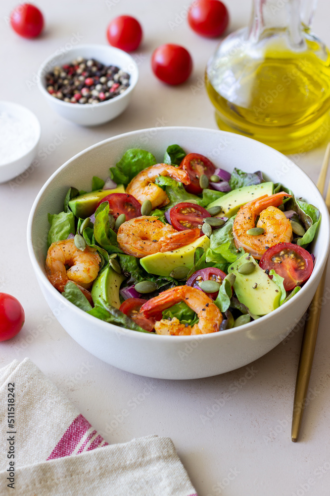 Salad with shrimps, avocado, tomatoes, onions and seeds. Healthy eating. Diet. Salad with shrimps, avocado, tomatoes, onions and seeds. Healthy eating. Diet.