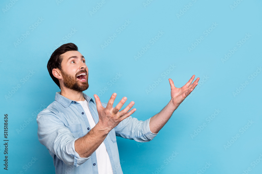 Naklejka premium Photo of crazy guy impressed bargain falling down arms wear denim outfit look isolated blue color background