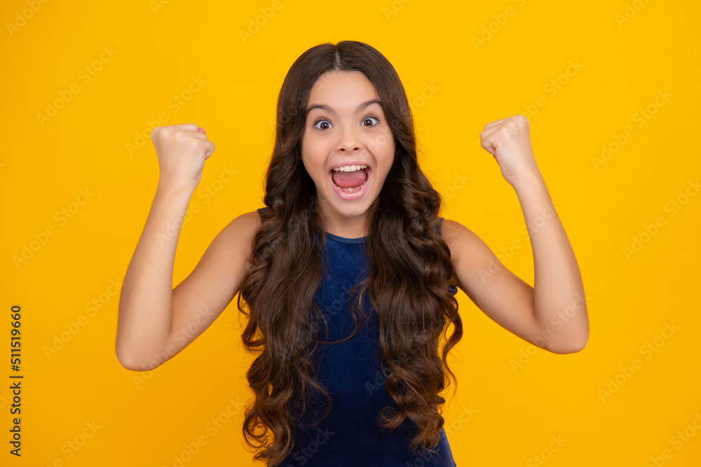 Amazed teen girl. Excited expression, cheerful and glad. Joy, victory, celebration and excitement concept. Excited face, cheerful emotions of teenager girl. Amazed teen girl. Excited expression, cheerful and glad. Joy, victory, celebration and excitement concept. Excited face, cheerful emotions of teenager girl.