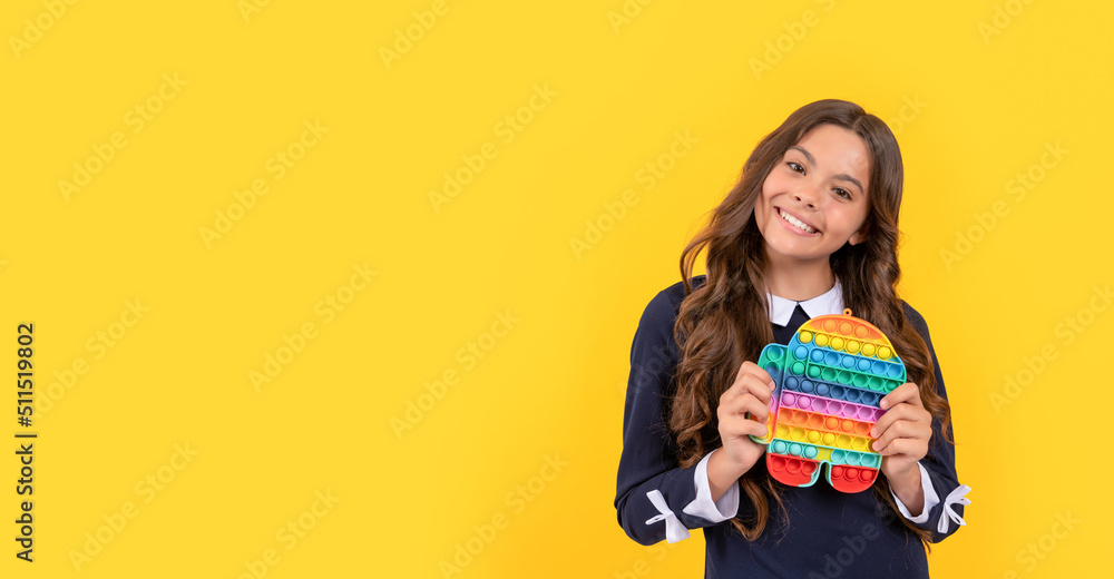 happy kid presenting product of pop it silicone sensory fidget toy, copy space, silicone toy happy kid presenting product of pop it silicone sensory fidget toy, copy space, silicone toy