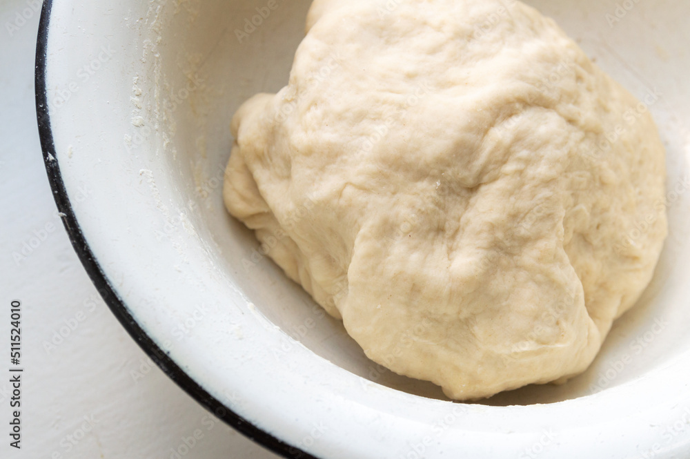 a piece of dough in a bowl a piece of dough in a bowl