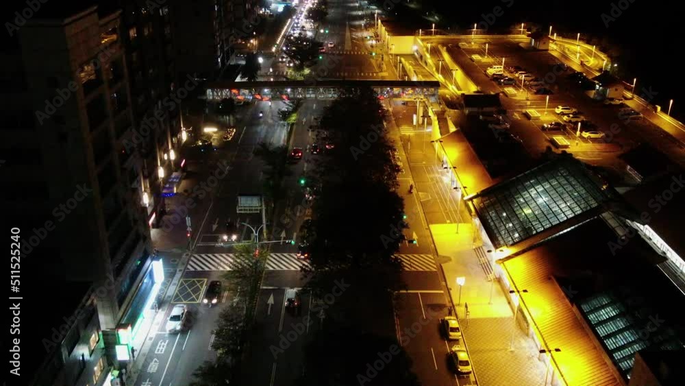 Aerial view on city roads and subway station in the night, Taiwan, Taipei, Tamsui, Hongshulin Aerial view on city roads and subway station in the night, Taiwan, Taipei, Tamsui, Hongshulin