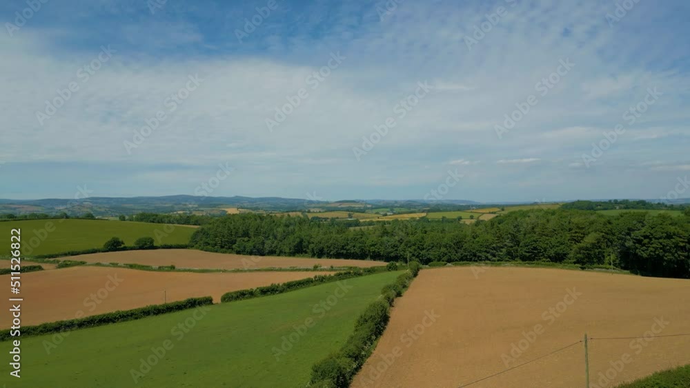 Ascending over rural agricultural fields in Devon