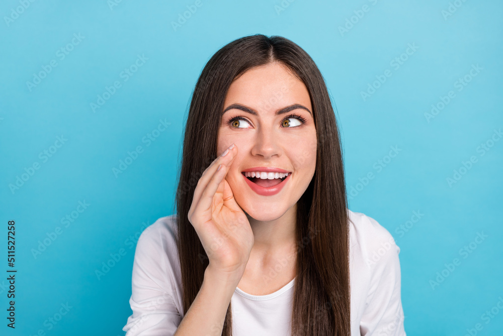 Portrait of charming lovely lady look blank space advertise promote product isolated on blue color background Portrait of charming lovely lady look blank space advertise promote product isolated on blue color background