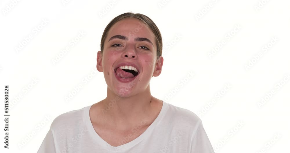 Portrait of white woman sensually smiling and licking her teeth. Isolated on white background. Portrait of white woman sensually smiling and licking her teeth. Isolated on white background.