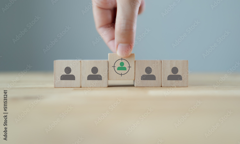 Target customer, buyer persona, marketing segmentation, job recruitment concept. Personalization marketing, customer centric strategies. Putting wooden cubes with focused on target customer symbols. Target customer, buyer persona, marketing segmentation, job recruitment concept. Personalization marketing, customer centric strategies. Putting wooden cubes with focused on target customer symbols.