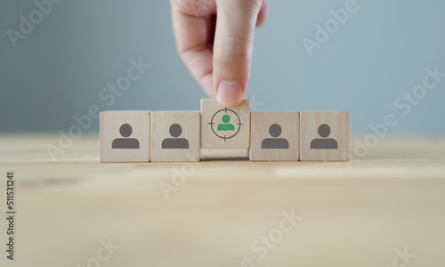 Target customer, buyer persona, marketing segmentation, job recruitment concept. Personalization marketing, customer centric strategies. Putting wooden cubes with focused on target customer symbols.