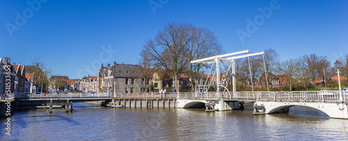 Panorama of a historic white bridge in the center of Harlingen, Netherlands photo