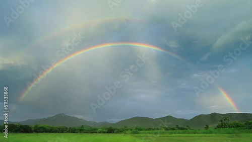 Beautiful Double Rainbows On Rainy Sky Time Lapse