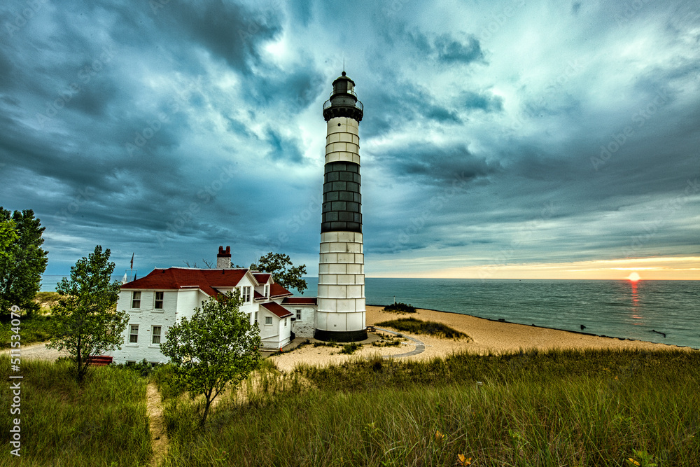 Big Sable Lighthouse in Ludington State Park in Michigan on Lake Michigan at sunset.