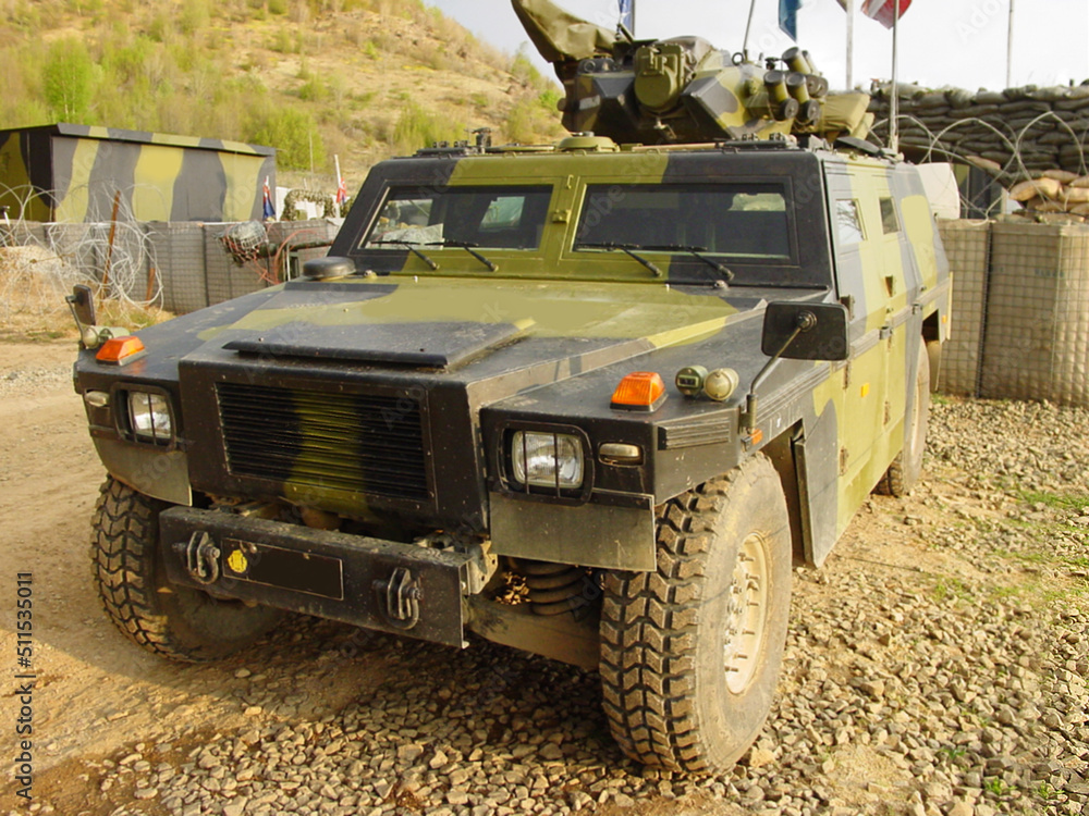 Fototapeta premium A parked military jeep - This is the real thing from KFOR, Kosovo 1999. This image is part of our historic collection. The digital cameras available back then where very bad, so expect exceptionally