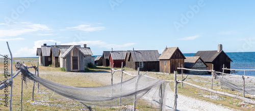 Fishermans cabin in a row by the sea. Huts on the island of Gotland in Sweden