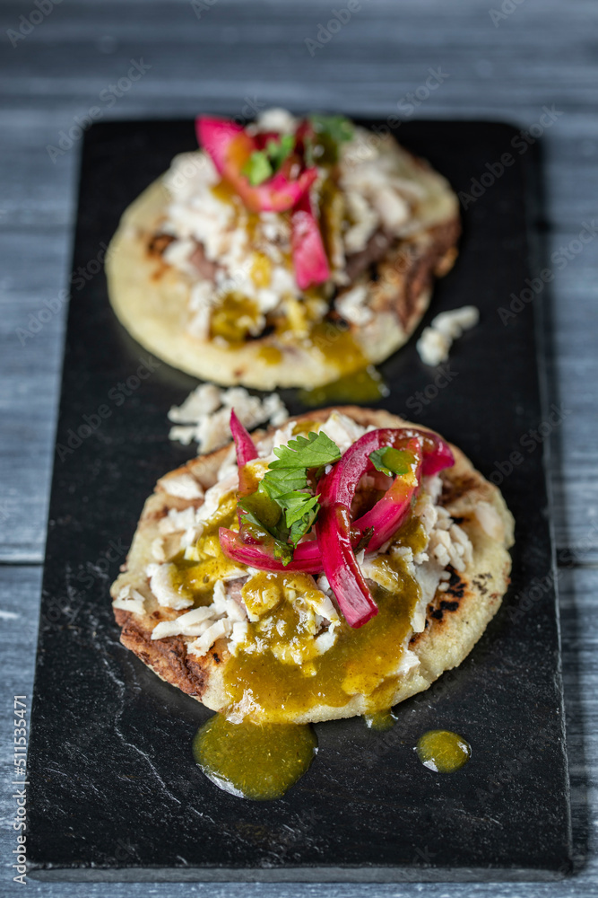 Yucatan panuchos served on slate Yucatan panuchos served on slate