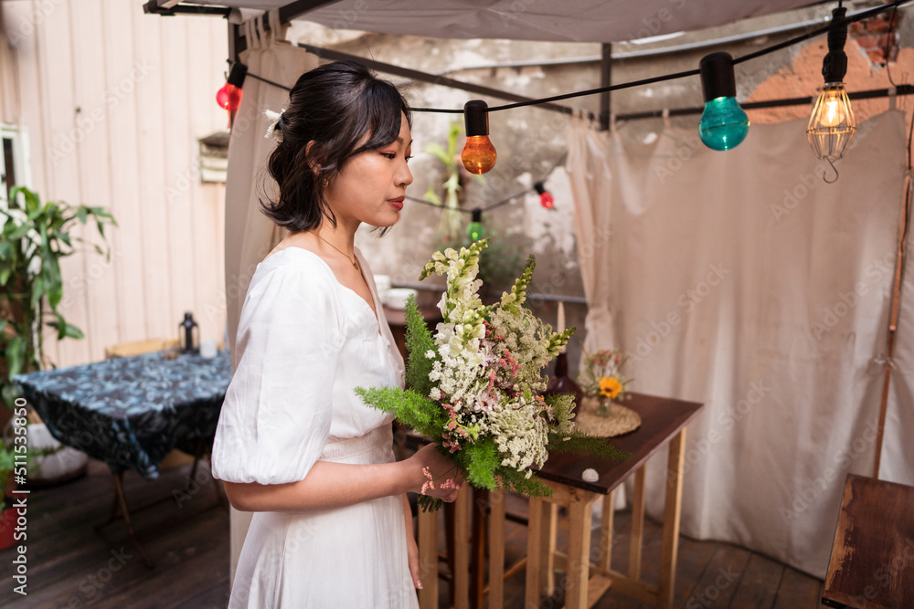 Young ethnic bride with bouquet of flowers Young ethnic bride with bouquet of flowers