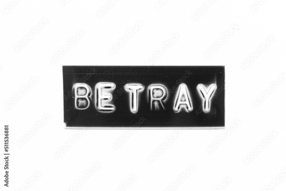 Black color banner that have embossed letter with word betray on white paper background Black color banner that have embossed letter with word betray on white paper background