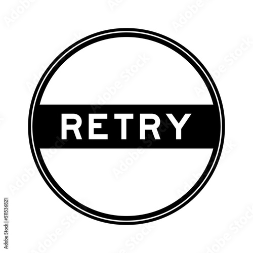 Black color round seal sticker in word retry on white background