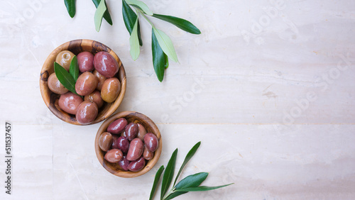 Wooden bowls of delicious olives