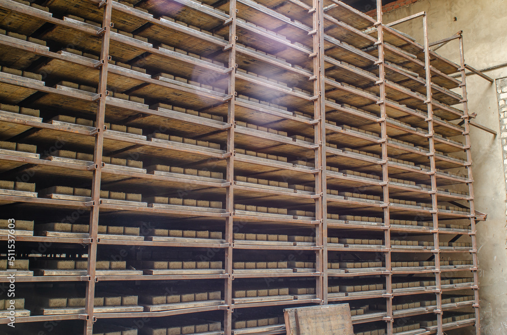 Shelving with cobblestones. Warehouse at the factory. Production of paving slabs. Shelving with cobblestones. Warehouse at the factory. Production of paving slabs.