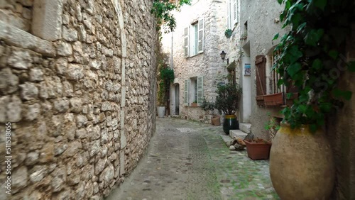 Medieval fortified village of Saint-Paul-de-Vence.
Empty narrow street in the south of France. Window openings and doors are decorated with decorative trim in St. Paul de Vence. Colorful old street