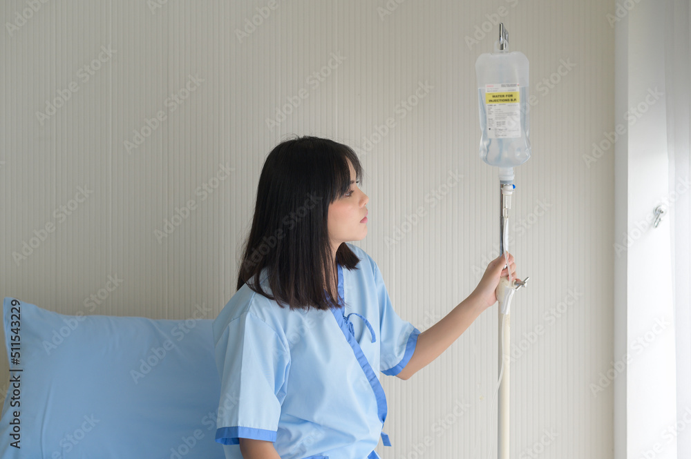 Hopeful and happy young patient woman in hospital, healthcare and medical concept Hopeful and happy young patient woman in hospital, healthcare and medical concept
