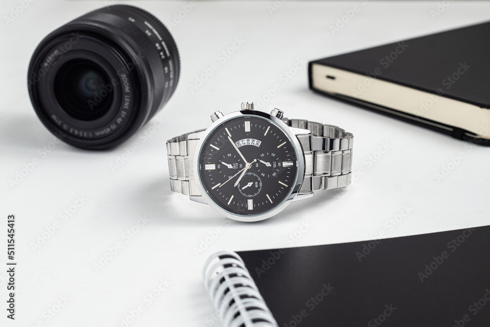 Luxury silver watch on white Table. Business man accessories Luxury silver watch on white Table. Business man accessories