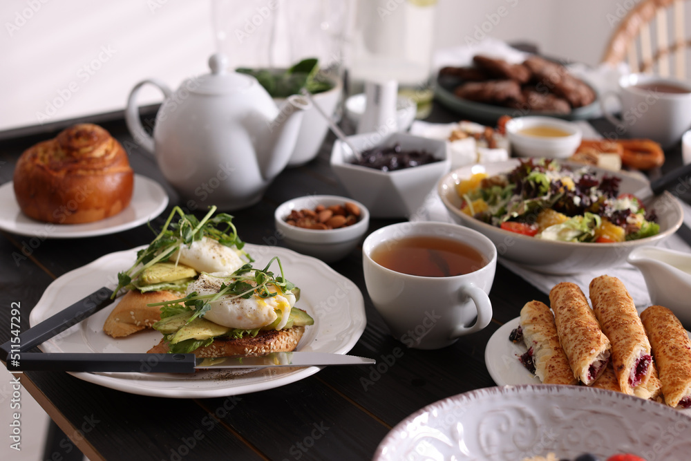 Many different dishes served on buffet table for brunch Many different dishes served on buffet table for brunch