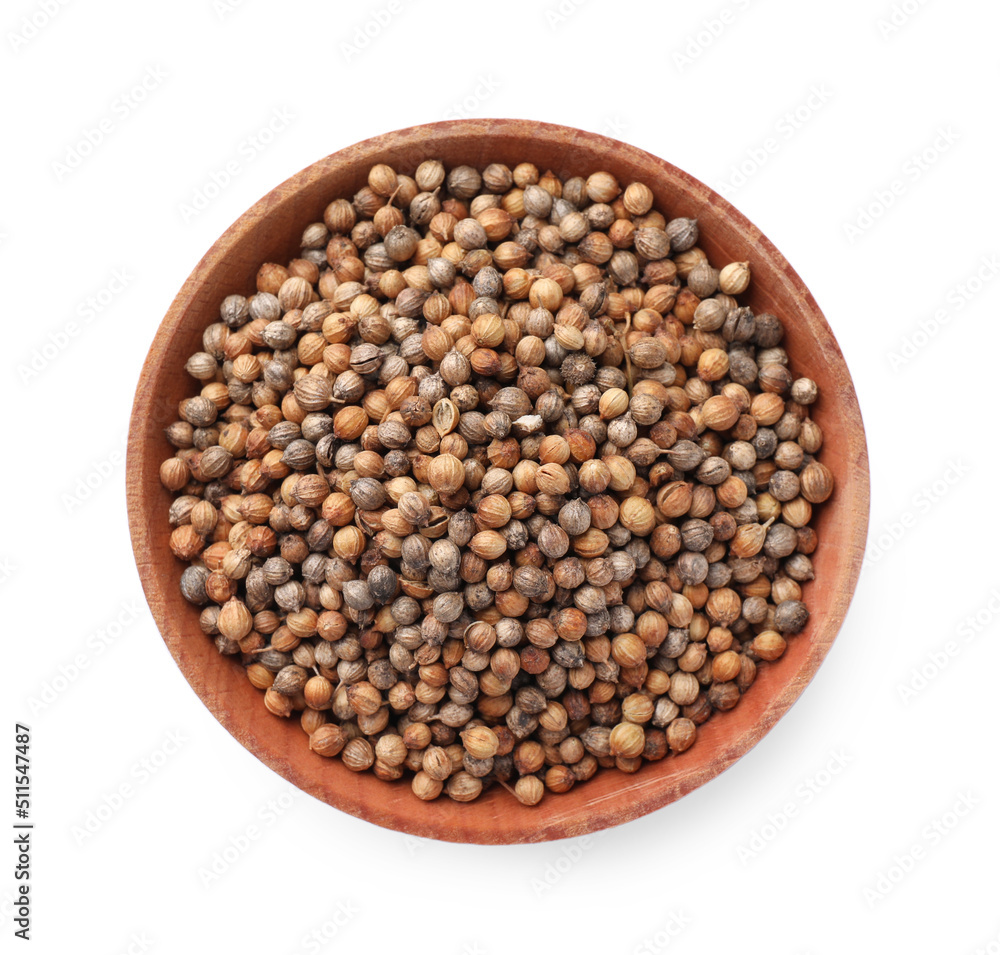 Wooden bowl of coriander grains on white background, top view Wooden bowl of coriander grains on white background, top view