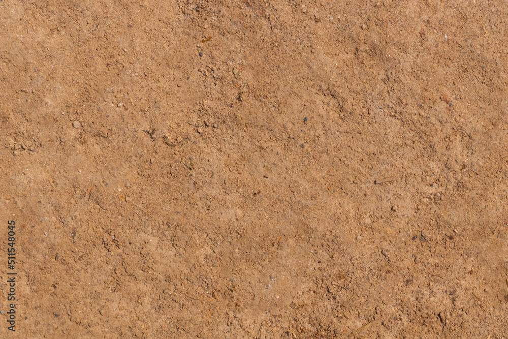 Arid sandy soil with many small stones can be used as a background or fertility and geology. Arid sandy soil with many small stones can be used as a background or fertility and geology.