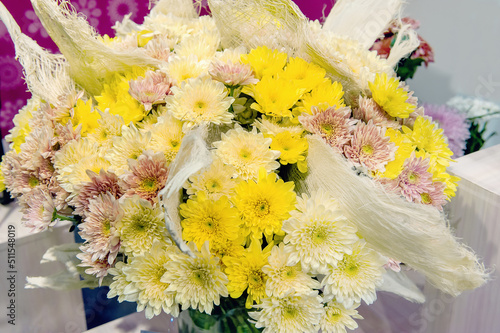 bouquet of yellow and white large chrysanthemums. Decoration of premises with plants and flowers