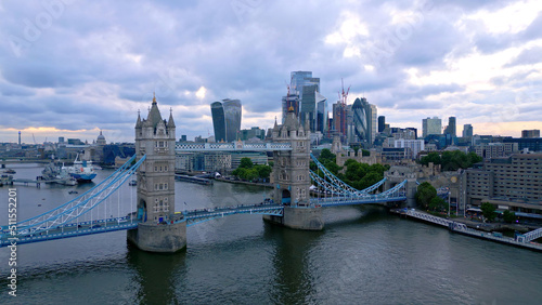 Famous Tower Bridge and City of London in the evening - aerial view