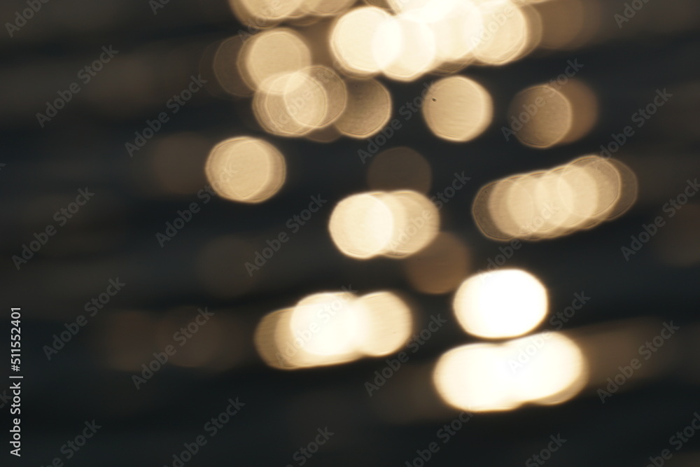 Fototapeta premium Sun reflecting in water - defocused background, bokeh effect