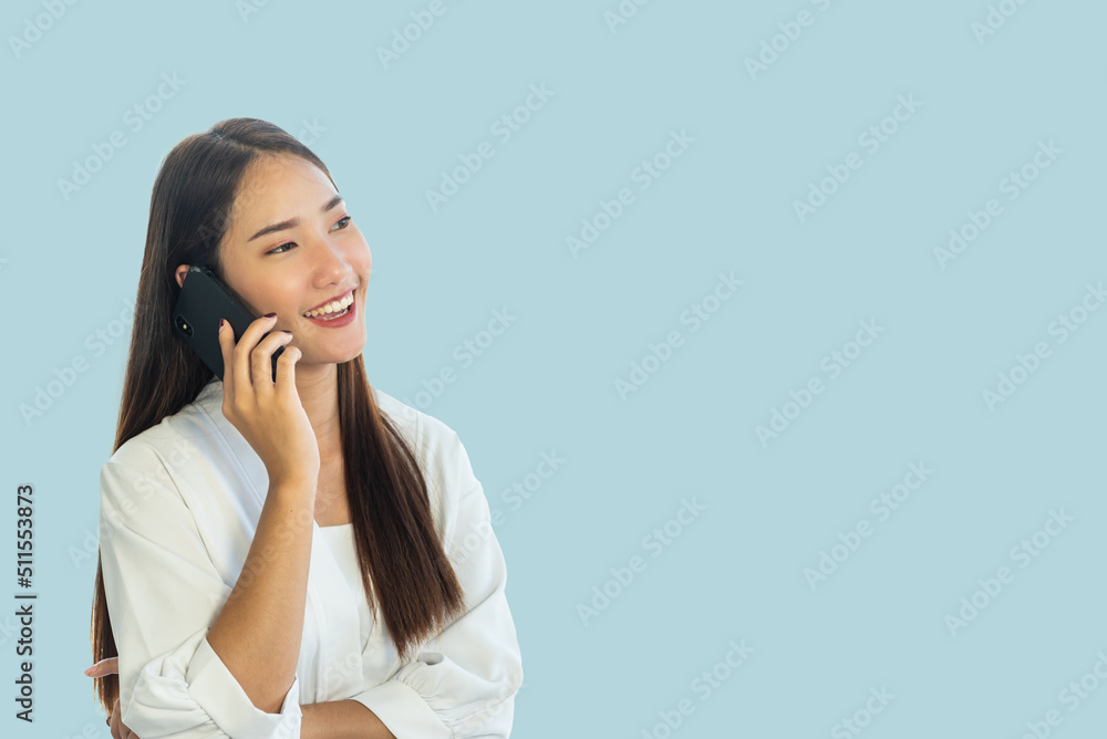Young Asian woman talking on the phone. Young Asian woman talking on the phone.