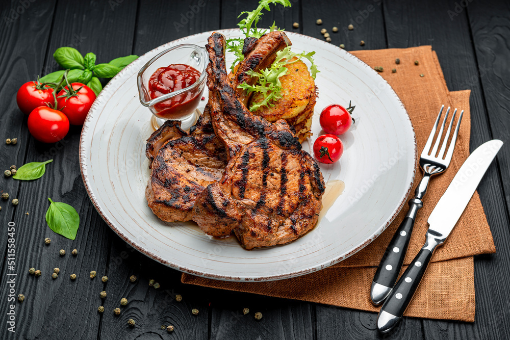 Pork steak with bone and potato pancakes Pork steak with bone and potato pancakes