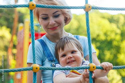 beautiful girl with children on a children's playground © Minakryn Ruslan 