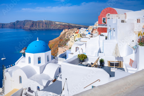 Oia town on Santorini island  Greece. Traditional and famous houses and churches with blue domes over the Caldera  Aegean sea