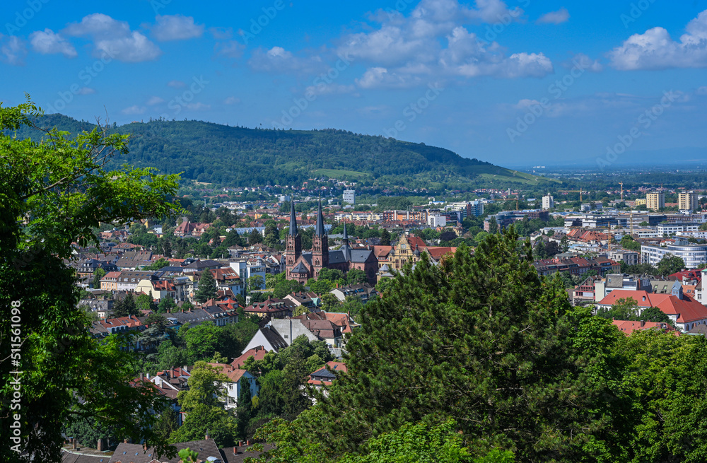 Panorama of the city of Freiburg im Breisgau with church of St. John‘s Church in the foreground, Germany, Europe