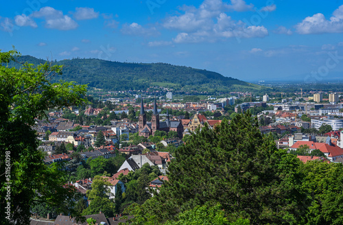 Panorama of the city of Freiburg im Breisgau with church of St. John‘s Church in the foreground, Germany, Europe