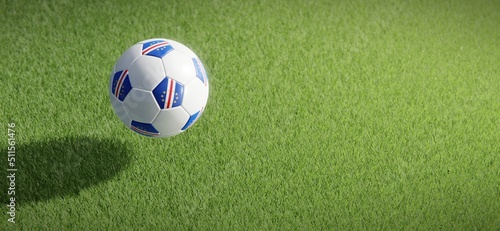 Football or soccer ball design with flag of Cabo Verde against grass pitch backdrop. 3D rendering