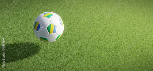 Football or soccer ball design with flag of Gabon against grass pitch backdrop. 3D rendering