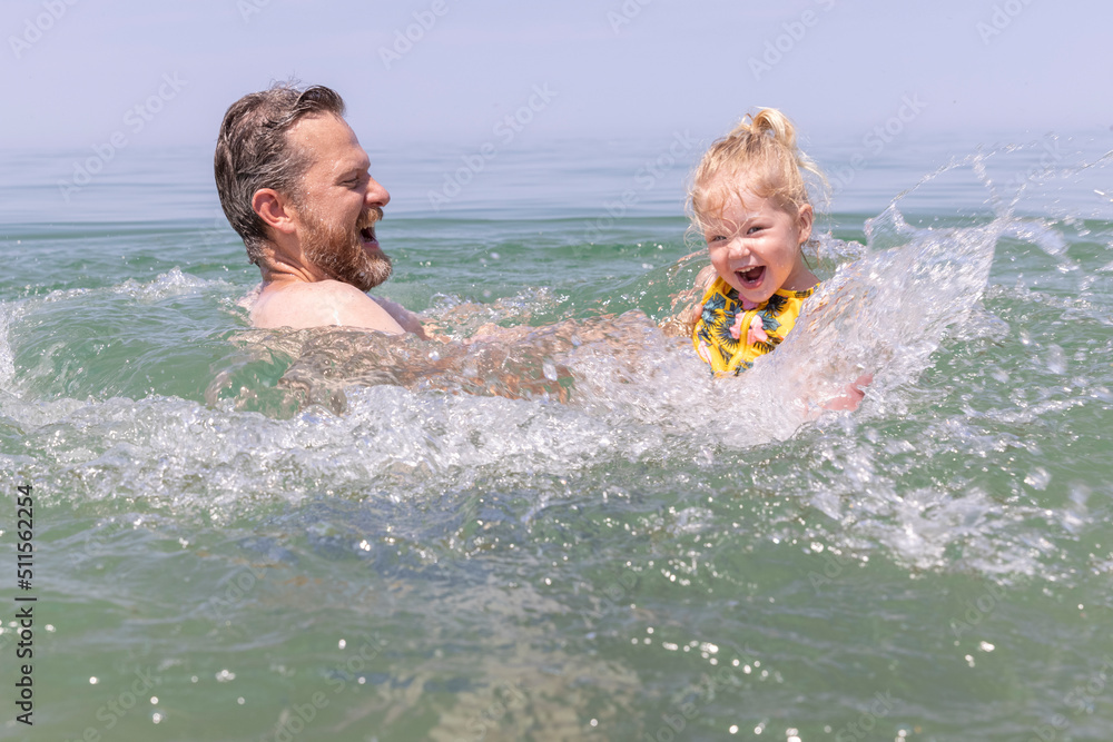 Father and daughter swimming in Lake Michigan at the Indiana Dunes National Park NPS Father and daughter swimming in Lake Michigan at the Indiana Dunes National Park NPS