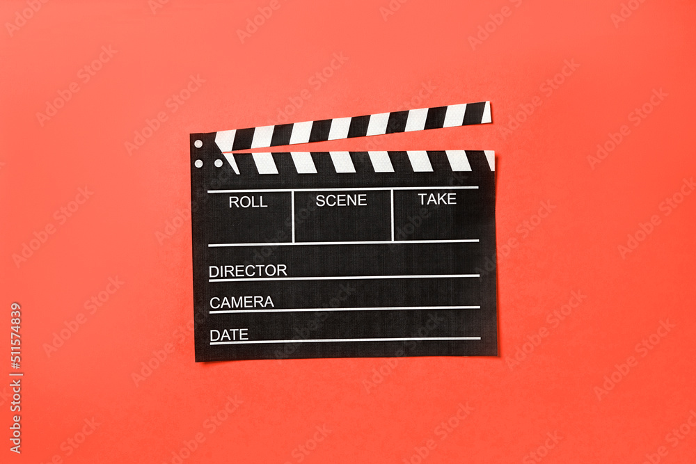 Photo of movie clapper on red background