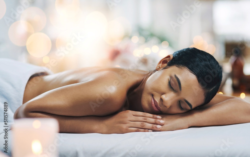 Falling asleep. Shot of a relaxed an cheerful young woman getting a massage indoors at a spa.