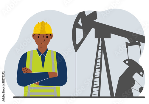 Oil refinery engineer. A male worker in front of a pumping unit for oil extraction, oil drilling and well repair.