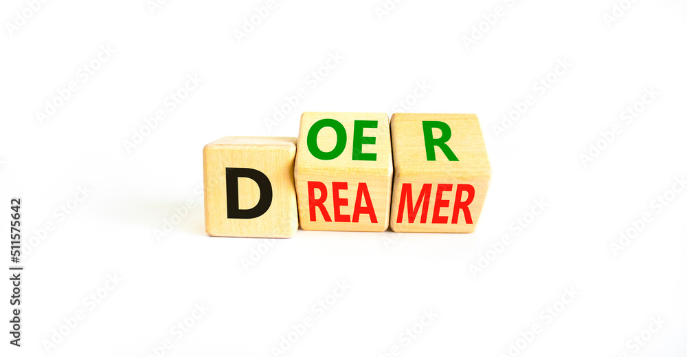 Doer or dreamer symbol. Concept words Doer or dreamer on wooden cubes. Beautiful white table white background. Business and doer or dreamer concept. Copy space. Doer or dreamer symbol. Concept words Doer or dreamer on wooden cubes. Beautiful white table white background. Business and doer or dreamer concept. Copy space.