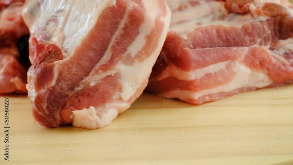 Pork ribs raw on the board. selective focus. Pork ribs raw on the board. selective focus.