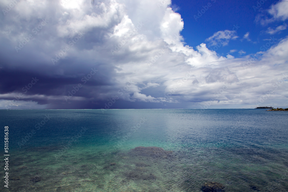 Rain clouds over the Pacific Ocean near Papeete Island. Raining clouds over sea nature environment concept.