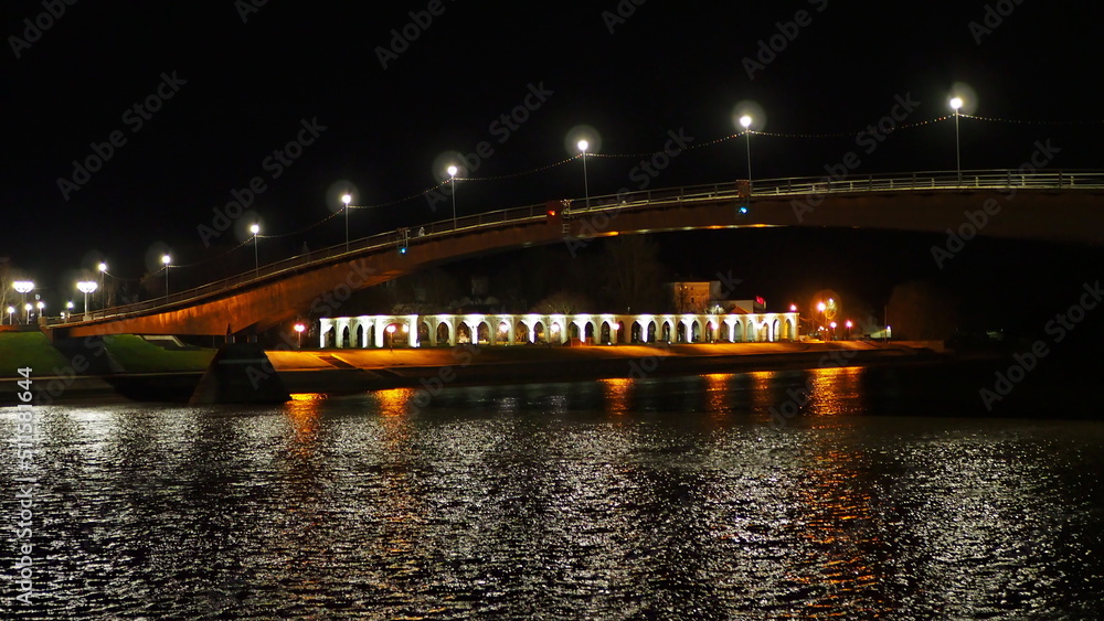 Historical monument. Night view of the Volkhov River, the Gostiny Dvor Arcade and the Great Bridge. Veliky Novgorod, Russia.