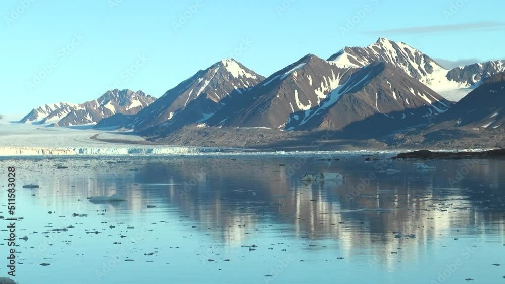 Moving Ice Floes on background of mountain on water of Arctic Ocean in Svalbard. Unique footage on background natural landscape and snow of Spitsbergen. Moving Ice Floes on background of mountain on water of Arctic Ocean in Svalbard. Unique footage on background natural landscape and snow of Spitsbergen.