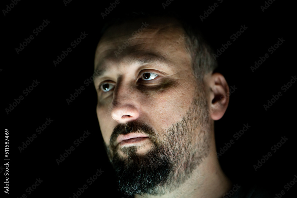 Portrait of 40 years old man on a black background. High quality photo Portrait of 40 years old man on a black background. High quality photo