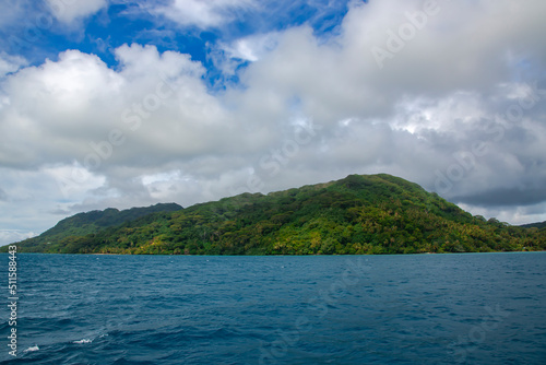 Beautiful Paradise island before the rain in the blue lagoon on the Leeward group of the Society Islands of French Polynesia. © Tanya Keisha